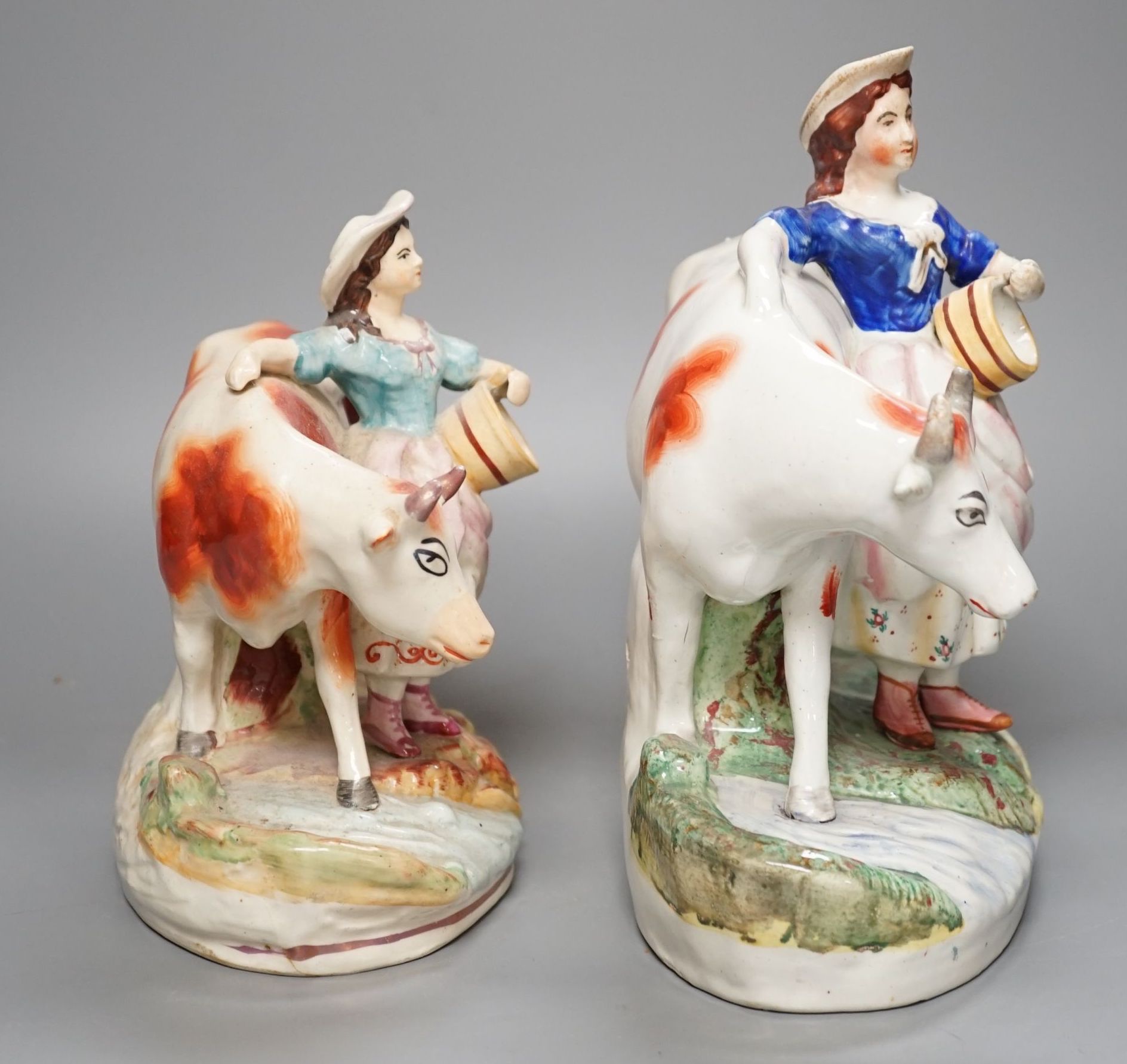 Two 19th century Staffordshire milk maid groups - tallest 24.5cm